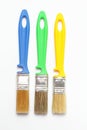 Three paint brushes with colored handle Royalty Free Stock Photo