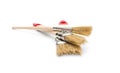 Three paint brushes on white background