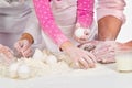 Family kneading dough Royalty Free Stock Photo