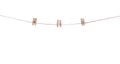 Three pair of wood clothes clip patterns hanging on brown string isolated on white background , clipping path Royalty Free Stock Photo