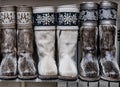 Fur boots made of natural deerskin decorated with floral embroidery with threads or stones. Royalty Free Stock Photo