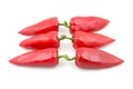 Three pairs of red sweet pepper on white background