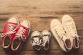 Three pairs of shoes lay on the wooden floor of the family, Royalty Free Stock Photo