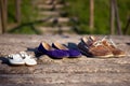 Three pairs of shoes - men's, women's, and children