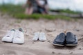 Three pairs of shoes on the sand - adult and child for newborns. Royalty Free Stock Photo