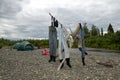 Three pairs of waders hanging out to dry