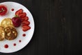 Three pancakes with cheese and strawberries and sauce on a white dish against wood background. Delicious cheese pancake and Royalty Free Stock Photo