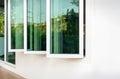 Three panel aluminium casement window stay on white wall Royalty Free Stock Photo