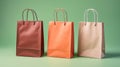 Three paper bags on pastel background