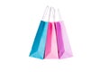 Three paper pink, purple,blue shopping bags isolated. Top view Royalty Free Stock Photo