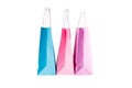 Three paper pink, purple,blue shopping bags isolated. Top view Royalty Free Stock Photo