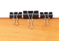 Three paperclips stapling papers Royalty Free Stock Photo