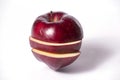 Three parts of the cut red apple are shifted relative to each other. Royalty Free Stock Photo