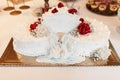 White wedding cake with two sugary swans and red roses Royalty Free Stock Photo