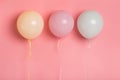 Three party balloons with blank space for advertisement on pink