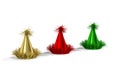 Three party hats in gold, red and green colors on a white background