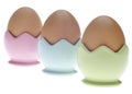 Three Pastel Egg Cups with Brown Eggs Royalty Free Stock Photo