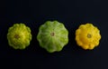 Three pattypan squash vegetable dark background. Royalty Free Stock Photo