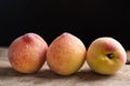 Three peaches fruit on wooden Royalty Free Stock Photo