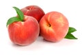 Three peaches with green leaf isolated on white background Royalty Free Stock Photo