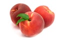 Three peaches with green leaf isolated on white background Royalty Free Stock Photo