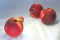 Three peaches are on the table Royalty Free Stock Photo