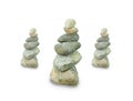 Three Pebble towers isolated on white background. Balanced stones in a pile. Three piles of rocks Royalty Free Stock Photo