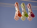 Three pegs hanging on the line