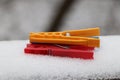 A three pegs lying on parapet who is covered by snow