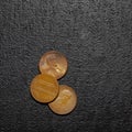 Three pennies, US currency, one cent coins. isolated on black bacground. 1x1 Royalty Free Stock Photo