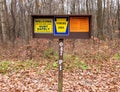 Three Pennsylvania Game Commission signs in the parking lot of State Game Lands 47 in Venango County, Pennsylvania, USA