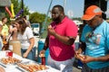 Three People Compete In Hot Dog Eating Contest Royalty Free Stock Photo