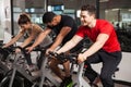 Three people doing spinning in a gym Royalty Free Stock Photo