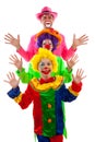 Three people dressed up as colorful funny clown