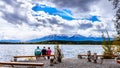 Three People enjoying the view of Pyramid Lake with the Whistlers Mountain in the background in Jasper National Park Royalty Free Stock Photo