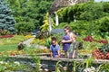 Three people gazing into the pond