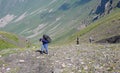 Three people and mountains