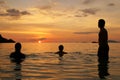 Three people waiting for the sunset Royalty Free Stock Photo