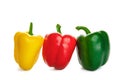Three peppers in the droplets of water. on a white background
