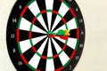 Three perfect darts shoot at the target darts different color red yellow and green Royalty Free Stock Photo