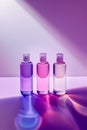 three perfume bottles are displayed in front of an ombreal background