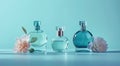 three perfume bottles with flowers on blue background Royalty Free Stock Photo