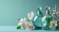 three perfume bottles with flowers on blue background Royalty Free Stock Photo