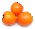 Three persimmons fruit whole isolated on a white