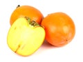 Three persimmons on white background. Royalty Free Stock Photo
