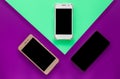 three phones on green and purple backgound