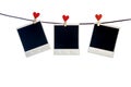 Three photoframes with red heart clothepins Royalty Free Stock Photo