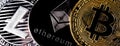 Three physical metal coins - Litcoin, Ethereum and Bitcoin. Cryptocurrency concepts