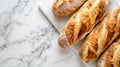 Three loaves of bread on a marble counter Royalty Free Stock Photo