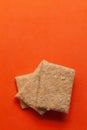 Three pieces of Indian mithai (dessert), delicate, soft, crunchy Gajak Bars.